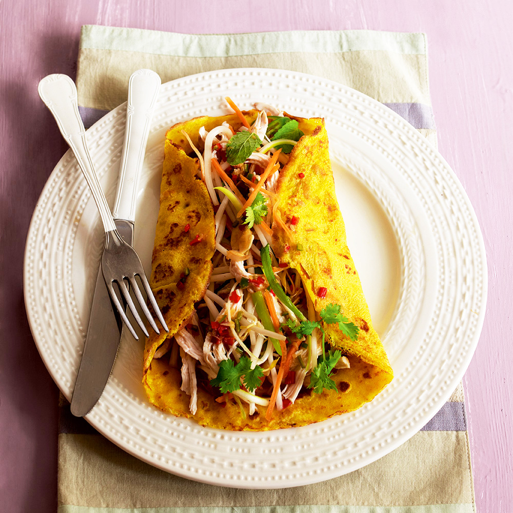 Vietnamese savoury pancakes with shredded chicken and vegetables